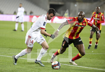 2021-04-03 - Leo Dubois of Lyon, Seko Fofana of Lens during the French championship Ligue 1 football match between RC Lens and Olympique Lyonnais (OL, Lyon) on April 3, 2021 at Stade Bollaert-Delelis in Lens, France - Photo Jean Catuffe / DPPI - RC LENS VS OLYMPIQUE LYONNAIS - FRENCH LIGUE 1 - SOCCER