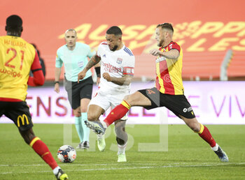 2021-04-03 - Memphis Depay of Lyon, Jonathan Gradit of Lens during the French championship Ligue 1 football match between RC Lens and Olympique Lyonnais (OL, Lyon) on April 3, 2021 at Stade Bollaert-Delelis in Lens, France - Photo Jean Catuffe / DPPI - RC LENS VS OLYMPIQUE LYONNAIS - FRENCH LIGUE 1 - SOCCER