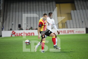 2021-04-03 - Duel GRADIT 24 Lens and KADEWERE 11 Lyon during the French championship Ligue 1 football match between RC Lens and Olympique Lyonnais on April 3, 2021 at Bollaert-Delelis stadium in Lens, France - Photo Laurent Sanson / LS Medianord / DPPI - RC LENS VS OLYMPIQUE LYONNAIS - FRENCH LIGUE 1 - SOCCER