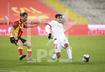 2021-04-03 - Lucas Paqueta of Lyon, Yannick Cahuzac of Lens (left) during the French championship Ligue 1 football match between RC Lens and Olympique Lyonnais (OL, Lyon) on April 3, 2021 at Stade Bollaert-Delelis in Lens, France - Photo Jean Catuffe / DPPI - RC LENS VS OLYMPIQUE LYONNAIS - FRENCH LIGUE 1 - SOCCER