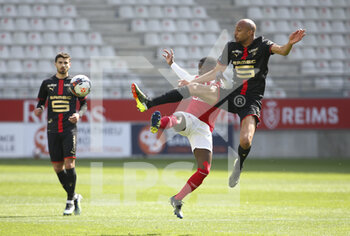 2021-04-04 - Steven Nzonzi of Rennes, Moreto Cassama of Reims during the French championship Ligue 1 football match between Stade de Reims and Stade Rennais (Rennes) on April 4, 2021 at Stade Auguste Delaune in Reims, France - Photo Jean Catuffe / DPPI - STADE DE REIMS VS STADE RENNAIS (RENNES) - FRENCH LIGUE 1 - SOCCER