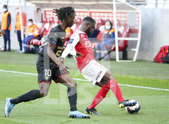 2021-04-04 - Moreto Cassama of Reims, Eduardo Camavinga of Rennes (left) during the French championship Ligue 1 football match between Stade de Reims and Stade Rennais (Rennes) on April 4, 2021 at Stade Auguste Delaune in Reims, France - Photo Jean Catuffe / DPPI - STADE DE REIMS VS STADE RENNAIS (RENNES) - FRENCH LIGUE 1 - SOCCER
