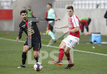2021-04-04 - Thomas Foket of Reims, Martin Terrier of Stade Rennais (left) during the French championship Ligue 1 football match between Stade de Reims and Stade Rennais (Rennes) on April 4, 2021 at Stade Auguste Delaune in Reims, France - Photo Jean Catuffe / DPPI - STADE DE REIMS VS STADE RENNAIS (RENNES) - FRENCH LIGUE 1 - SOCCER