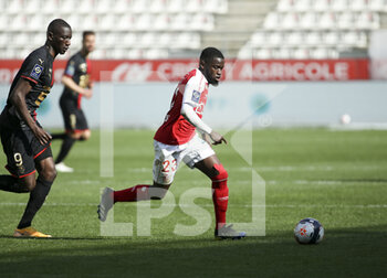 2021-04-04 - Moreto Cassama of Reims, Serhou Guirassy of Rennes (left) during the French championship Ligue 1 football match between Stade de Reims and Stade Rennais (Rennes) on April 4, 2021 at Stade Auguste Delaune in Reims, France - Photo Jean Catuffe / DPPI - STADE DE REIMS VS STADE RENNAIS (RENNES) - FRENCH LIGUE 1 - SOCCER