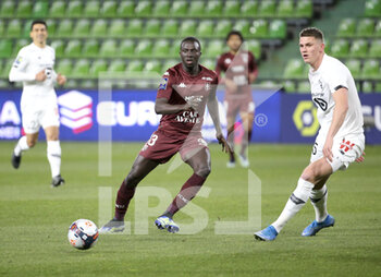 2021-04-09 - Lamine Gueye of FC Metz, Sven Botman of Lille during the French championship Ligue 1 football match between FC Metz and Lille OSC (LOSC) on April 9, 2021 at Stade Saint-Symphorien in Metz, France - Photo Jean Catuffe / DPPI - FC METZ VS LILLE OSC (LOSC) - FRENCH LIGUE 1 - SOCCER