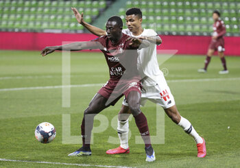 2021-04-09 - Lamine Gueye of FC Metz, Reinildo Mandava of Lille during the French championship Ligue 1 football match between FC Metz and Lille OSC (LOSC) on April 9, 2021 at Stade Saint-Symphorien in Metz, France - Photo Jean Catuffe / DPPI - FC METZ VS LILLE OSC (LOSC) - FRENCH LIGUE 1 - SOCCER