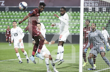 2021-04-09 - John Boye of FC Metz, Jonathan Bamba of Lille during the French championship Ligue 1 football match between FC Metz and Lille OSC (LOSC) on April 9, 2021 at Stade Saint-Symphorien in Metz, France - Photo Jean Catuffe / DPPI - FC METZ VS LILLE OSC (LOSC) - FRENCH LIGUE 1 - SOCCER