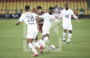 2021-04-09 - Jonathan Bamba of Lille, Fabien Centonze of FC Metz during the French championship Ligue 1 football match between FC Metz and Lille OSC (LOSC) on April 9, 2021 at Stade Saint-Symphorien in Metz, France - Photo Jean Catuffe / DPPI - FC METZ VS LILLE OSC (LOSC) - FRENCH LIGUE 1 - SOCCER
