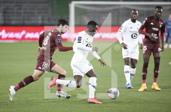 2021-04-09 - Jonathan Bamba of Lille, Fabien Centonze of FC Metz (left) during the French championship Ligue 1 football match between FC Metz and Lille OSC (LOSC) on April 9, 2021 at Stade Saint-Symphorien in Metz, France - Photo Jean Catuffe / DPPI - FC METZ VS LILLE OSC (LOSC) - FRENCH LIGUE 1 - SOCCER