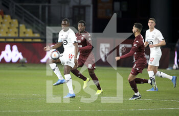 2021-04-09 - Boubakary Soumare of Lille, Aaron Leya Iseka of FC Metz during the French championship Ligue 1 football match between FC Metz and Lille OSC (LOSC) on April 9, 2021 at Stade Saint-Symphorien in Metz, France - Photo Jean Catuffe / DPPI - FC METZ VS LILLE OSC (LOSC) - FRENCH LIGUE 1 - SOCCER