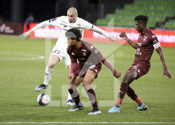 2021-04-09 - Burak Yilmaz of Lille, Matthieu Udol, John Boye of FC Metz during the French championship Ligue 1 football match between FC Metz and Lille OSC (LOSC) on April 9, 2021 at Stade Saint-Symphorien in Metz, France - Photo Jean Catuffe / DPPI - FC METZ VS LILLE OSC (LOSC) - FRENCH LIGUE 1 - SOCCER