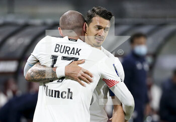 2021-04-09 - Burak Yilmaz of Lille celebrates his goal with Jose Fonte during the French championship Ligue 1 football match between FC Metz and Lille OSC (LOSC) on April 9, 2021 at Stade Saint-Symphorien in Metz, France - Photo Jean Catuffe / DPPI - FC METZ VS LILLE OSC (LOSC) - FRENCH LIGUE 1 - SOCCER