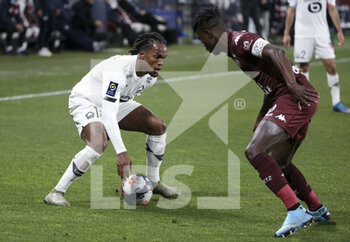 2021-04-09 - Renato Sanches of Lille, John Boye of FC Metz during the French championship Ligue 1 football match between FC Metz and Lille OSC (LOSC) on April 9, 2021 at Stade Saint-Symphorien in Metz, France - Photo Jean Catuffe / DPPI - FC METZ VS LILLE OSC (LOSC) - FRENCH LIGUE 1 - SOCCER