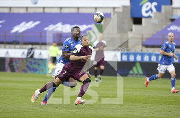 2021-04-10 - Kylian Mbappe of PSG, Lamine Kone of Strasbourg (left) during the French championship Ligue 1 football match between RC Strasbourg Alsace (RCSA) and Paris Saint-Germain (PSG) on April 10, 2021 at La Meinau stadium in Strasbourg, France - Photo Jean Catuffe / DPPI - RC STRASBOURG AND PARIS SAINT-GERMAIN - FRENCH LIGUE 1 - SOCCER