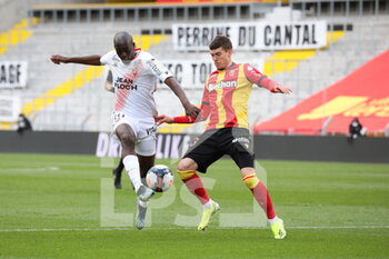 2021-04-11 - Duel Yoane Wissa 19 Lorient and Clément Michelin 13 RC Lens during the French championship Ligue 1 football match between RC Lens and FC Lorient on April 11, 2021 at Bollaert-Delelis stadium in Lens, France - Photo Laurent Sanson / LS Medianord / DPPI - RC LENS VS FC LORIENT - FRENCH LIGUE 1 - SOCCER