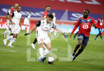 2021-04-16 - Jordan Ferri of Montpellier, Jonathan Ikone of Lille during the French championship Ligue 1 football match between LOSC and Montpellier HSC on April 16, 2021 at Pierre Mauroy stadium in Villeneuve-d'Ascq near Lille, France - Photo Jean Catuffe / DPPI - LOSC VS MONTPELLIER HSC - FRENCH LIGUE 1 - SOCCER