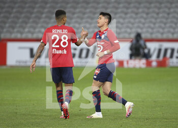 2021-04-16 - Luiz Araujo of Lille celebrates his goal with Reinildo Mandava (left) during the French championship Ligue 1 football match between LOSC and Montpellier HSC on April 16, 2021 at Pierre Mauroy stadium in Villeneuve-d'Ascq near Lille, France - Photo Jean Catuffe / DPPI - LOSC VS MONTPELLIER HSC - FRENCH LIGUE 1 - SOCCER