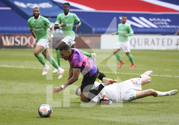 2021-04-18 - Kylian Mbappe of PSG stumbles on goalkeeper of Saint-Etienne Etienne Green and gets a penalty during the French championship Ligue 1 football match between Paris Saint-Germain (PSG) and AS Saint-Etienne (ASSE) on April 18, 2021 at Parc des Princes stadium in Paris, France - Photo Jean Catuffe / DPPI - PARIS SAINT-GERMAIN (PSG) VS AS SAINT-ETIENNE (ASSE) - FRENCH LIGUE 1 - SOCCER