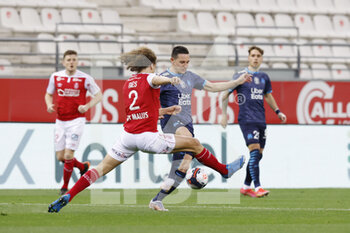 2021-04-23 - Florian Thauvin of OM and Wout Faes of Reims during the French championship Ligue 1 football match between Stade de Reims and Olympique de Marseille on April 23, 2021 at Auguste Delaune stadium in Reims, France - Photo Loic Baratoux / DPPI - STADE DE REIMS VS OLYMPIQUE DE MARSEILLE (OM) - FRENCH LIGUE 1 - SOCCER