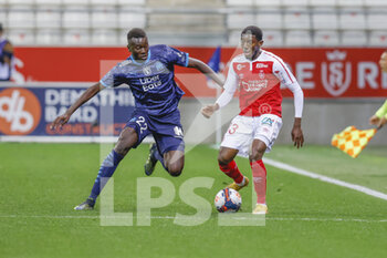 2021-04-23 - Fode Doucoure of Reims and Pape Gueye of OM during the French championship Ligue 1 football match between Stade de Reims and Olympique de Marseille on April 23, 2021 at Auguste Delaune stadium in Reims, France - Photo Loic Baratoux / DPPI - STADE DE REIMS VS OLYMPIQUE DE MARSEILLE (OM) - FRENCH LIGUE 1 - SOCCER