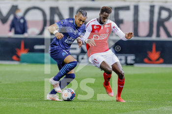 2021-04-23 - Dimitri Payet of OM and Boulaye Dia of Reims during the French championship Ligue 1 football match between Stade de Reims and Olympique de Marseille on April 23, 2021 at Auguste Delaune stadium in Reims, France - Photo Loic Baratoux / DPPI - STADE DE REIMS VS OLYMPIQUE DE MARSEILLE (OM) - FRENCH LIGUE 1 - SOCCER