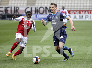 2021-04-23 - Fode Doucoure of Reims, Arkadiusz Milik of Marseille during the French championship Ligue 1 football match between Stade de Reims and Olympique de Marseille (OM) on April 23, 2021 at Stade Auguste Delaune in Reims, France - Photo Jean Catuffe / DPPI - STADE DE REIMS VS OLYMPIQUE DE MARSEILLE (OM) - FRENCH LIGUE 1 - SOCCER