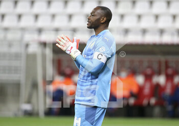 2021-04-23 - Goalkeeper of Marseille Steve Mandanda during the French championship Ligue 1 football match between Stade de Reims and Olympique de Marseille (OM) on April 23, 2021 at Stade Auguste Delaune in Reims, France - Photo Jean Catuffe / DPPI - STADE DE REIMS VS OLYMPIQUE DE MARSEILLE (OM) - FRENCH LIGUE 1 - SOCCER