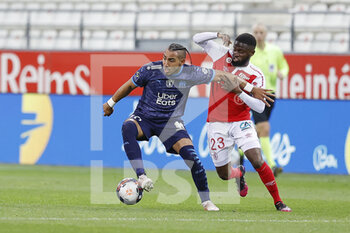 2021-04-23 - Dimitri Payet of OM and Moreto Cassama of Reims during the French championship Ligue 1 football match between Stade de Reims and Olympique de Marseille on April 23, 2021 at Auguste Delaune stadium in Reims, France - Photo Loic Baratoux / DPPI - STADE DE REIMS VS OLYMPIQUE DE MARSEILLE (OM) - FRENCH LIGUE 1 - SOCCER