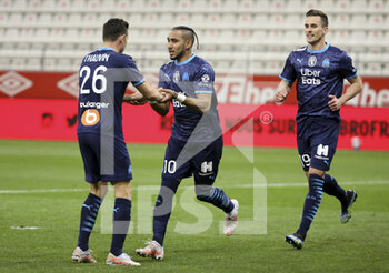 2021-04-23 - Dimitri Payet of Marseille celebrates his second goal with Florian Thauvin (left), Arkadiusz Milik of Marseille during the French championship Ligue 1 football match between Stade de Reims and Olympique de Marseille (OM) on April 23, 2021 at Stade Auguste Delaune in Reims, France - Photo Jean Catuffe / DPPI - STADE DE REIMS VS OLYMPIQUE DE MARSEILLE (OM) - FRENCH LIGUE 1 - SOCCER