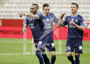 2021-04-23 - Dimitri Payet of Marseille celebrates his second goal with Florian Thauvin, Arkadiusz Milik of Marseille during the French championship Ligue 1 football match between Stade de Reims and Olympique de Marseille (OM) on April 23, 2021 at Stade Auguste Delaune in Reims, France - Photo Jean Catuffe / DPPI - STADE DE REIMS VS OLYMPIQUE DE MARSEILLE (OM) - FRENCH LIGUE 1 - SOCCER