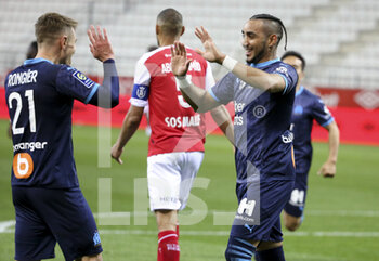 2021-04-23 - Dimitri Payet of Marseille celebrates his second goal with Valentin Rongier (left) during the French championship Ligue 1 football match between Stade de Reims and Olympique de Marseille (OM) on April 23, 2021 at Stade Auguste Delaune in Reims, France - Photo Jean Catuffe / DPPI - STADE DE REIMS VS OLYMPIQUE DE MARSEILLE (OM) - FRENCH LIGUE 1 - SOCCER