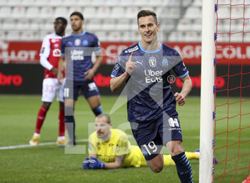 2021-04-23 - Arkadiusz Milik of Marseille celebrates his goal (ultimately cancelled) while goalkeeper of Reims Predrag Rajkovic lies down during the French championship Ligue 1 football match between Stade de Reims and Olympique de Marseille (OM) on April 23, 2021 at Stade Auguste Delaune in Reims, France - Photo Jean Catuffe / DPPI - STADE DE REIMS VS OLYMPIQUE DE MARSEILLE (OM) - FRENCH LIGUE 1 - SOCCER