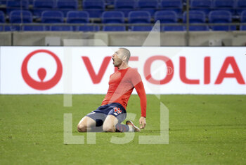 2021-04-25 - Burak Yilmaz of Lille celebrates his winning goal during the French championship Ligue 1 football match between Olympique Lyonnais (OL) and Lille OSC (LOSC) on April 25, 2021 at Groupama Stadium in Decines near Lyon, France - Photo Jean Catuffe / DPPI - OLYMPIQUE LYONNAIS (OL) VS LILLE OSC (LOSC) - FRENCH LIGUE 1 - SOCCER