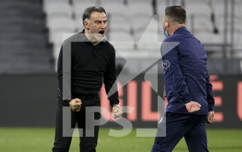 2021-04-25 - Coach of Lille OSC Christophe Galtier celebrates the victory following the French championship Ligue 1 football match between Olympique Lyonnais (OL) and Lille OSC (LOSC) on April 25, 2021 at Groupama Stadium in Decines near Lyon, France - Photo Jean Catuffe / DPPI - OLYMPIQUE LYONNAIS (OL) VS LILLE OSC (LOSC) - FRENCH LIGUE 1 - SOCCER