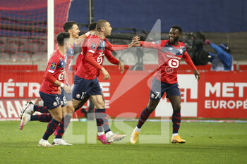2021-05-01 - Burak Yilmaz of Lille celebrates his goal with Jose Fonte, Jonathan Bamba during the French championship Ligue 1 football match between Lille OSC (LOSC) and OGC Nice (OGCN) on May 1, 2021 at Stade Pierre Mauroy in Villeneuve-d'Ascq near Lille, France - Photo Jean Catuffe / DPPI - LILLE OSC (LOSC) VS OGC NICE (OGCN) - FRENCH LIGUE 1 - SOCCER
