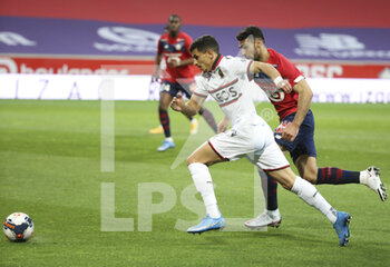 2021-05-01 - Youcef Atal of Nice, Mehmet Zeki Celik of Lille during the French championship Ligue 1 football match between Lille OSC (LOSC) and OGC Nice (OGCN) on May 1, 2021 at Stade Pierre Mauroy in Villeneuve-d'Ascq near Lille, France - Photo Jean Catuffe / DPPI - LILLE OSC (LOSC) VS OGC NICE (OGCN) - FRENCH LIGUE 1 - SOCCER