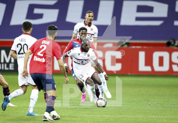 2021-05-01 - Hassane Kamara of Nice, Jonathan David of Lille, William Saliba of Nice during the French championship Ligue 1 football match between Lille OSC (LOSC) and OGC Nice (OGCN) on May 1, 2021 at Stade Pierre Mauroy in Villeneuve-d'Ascq near Lille, France - Photo Jean Catuffe / DPPI - LILLE OSC (LOSC) VS OGC NICE (OGCN) - FRENCH LIGUE 1 - SOCCER