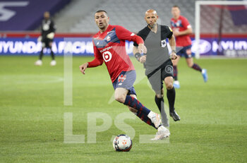 2021-05-01 - Burak Yilmaz of Lille, referee Amaury Delerue during the French championship Ligue 1 football match between Lille OSC (LOSC) and OGC Nice (OGCN) on May 1, 2021 at Stade Pierre Mauroy in Villeneuve-d'Ascq near Lille, France - Photo Jean Catuffe / DPPI - LILLE OSC (LOSC) VS OGC NICE (OGCN) - FRENCH LIGUE 1 - SOCCER