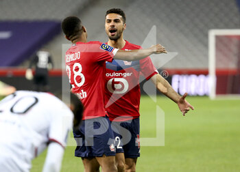 2021-05-01 - Mehmet Zeki Celik of Lille celebrates his goal with Reinildo Mandava during the French championship Ligue 1 football match between Lille OSC (LOSC) and OGC Nice (OGCN) on May 1, 2021 at Stade Pierre Mauroy in Villeneuve-d'Ascq near Lille, France - Photo Jean Catuffe / DPPI - LILLE OSC (LOSC) VS OGC NICE (OGCN) - FRENCH LIGUE 1 - SOCCER