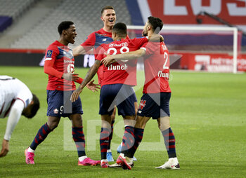 2021-05-01 - Mehmet Zeki Celik of Lille (right) celebrates his goal with Jonathan David, Sven Botman during the French championship Ligue 1 football match between Lille OSC (LOSC) and OGC Nice (OGCN) on May 1, 2021 at Stade Pierre Mauroy in Villeneuve-d'Ascq near Lille, France - Photo Jean Catuffe / DPPI - LILLE OSC (LOSC) VS OGC NICE (OGCN) - FRENCH LIGUE 1 - SOCCER
