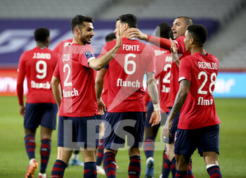 2021-05-01 - Mehmet Zeki Celik of Lille celebrates his goal with Jose Fonte, Burak Yilmaz, Reinildo Mandava during the French championship Ligue 1 football match between Lille OSC (LOSC) and OGC Nice (OGCN) on May 1, 2021 at Stade Pierre Mauroy in Villeneuve-d'Ascq near Lille, France - Photo Jean Catuffe / DPPI - LILLE OSC (LOSC) VS OGC NICE (OGCN) - FRENCH LIGUE 1 - SOCCER