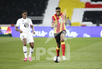 2021-05-07 - Steven Fortes of Lens, Jonathan David of Lille (left) during the French championship Ligue 1 football match between RC Lens and Lille OSC (LOSC) on May 7, 2021 at Stade Bollaert-Delelis in Lens, France - Photo Jean Catuffe / DPPI - RC LENS VS LOSC - FRENCH LIGUE 1 - SOCCER
