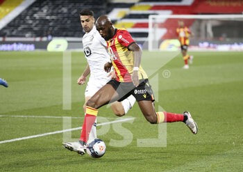 2021-05-07 - Seko Fofana of Lens, Mehmet Zeki Celik of Lille (left) during the French championship Ligue 1 football match between RC Lens and Lille OSC (LOSC) on May 7, 2021 at Stade Bollaert-Delelis in Lens, France - Photo Jean Catuffe / DPPI - RC LENS VS LOSC - FRENCH LIGUE 1 - SOCCER