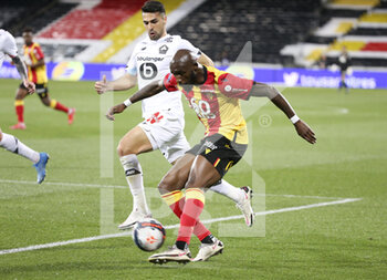 2021-05-07 - Seko Fofana of Lens, Mehmet Zeki Celik of Lille during the French championship Ligue 1 football match between RC Lens and Lille OSC (LOSC) on May 7, 2021 at Stade Bollaert-Delelis in Lens, France - Photo Jean Catuffe / DPPI - RC LENS VS LOSC - FRENCH LIGUE 1 - SOCCER