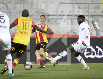 2021-05-07 - Yannick Cahuzac of Lens, Jonathan Bamba of Lille during the French championship Ligue 1 football match between RC Lens and Lille OSC (LOSC) on May 7, 2021 at Stade Bollaert-Delelis in Lens, France - Photo Jean Catuffe / DPPI - RC LENS VS LOSC - FRENCH LIGUE 1 - SOCCER