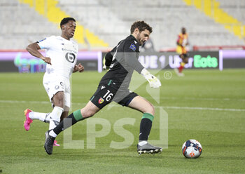 2021-05-07 - Goalkeeper of Lens Jean-Louis Leca, Jonathan David of Lille (left) during the French championship Ligue 1 football match between RC Lens and Lille OSC (LOSC) on May 7, 2021 at Stade Bollaert-Delelis in Lens, France - Photo Jean Catuffe / DPPI - RC LENS VS LOSC - FRENCH LIGUE 1 - SOCCER