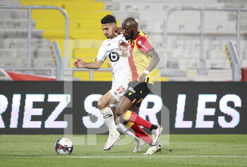 2021-05-07 - Mehmet Zeki Celik of Lille, Seko Fofana of Lens during the French championship Ligue 1 football match between RC Lens and Lille OSC (LOSC) on May 7, 2021 at Stade Bollaert-Delelis in Lens, France - Photo Jean Catuffe / DPPI - RC LENS VS LOSC - FRENCH LIGUE 1 - SOCCER