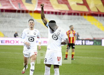 2021-05-07 - Jonathan David of Lille celebrates his goal with Luiz Araujo of Lille (left) during the French championship Ligue 1 football match between RC Lens and Lille OSC (LOSC) on May 7, 2021 at Stade Bollaert-Delelis in Lens, France - Photo Jean Catuffe / DPPI - RC LENS VS LOSC - FRENCH LIGUE 1 - SOCCER