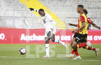 2021-05-07 - Timothy Weah of Lille, Loic Bade of Lens during the French championship Ligue 1 football match between RC Lens and Lille OSC (LOSC) on May 7, 2021 at Stade Bollaert-Delelis in Lens, France - Photo Jean Catuffe / DPPI - RC LENS VS LOSC - FRENCH LIGUE 1 - SOCCER