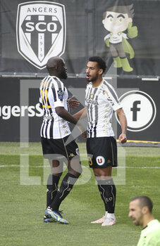 2021-05-09 - Angelo Fulgini of Angers celebrates his goal with Sada Thioub (left) during the French championship Ligue 1 football match between Angers SCO and Dijon FCO (DFCO) on May 9, 2021 at Stade Raymond Kopa in Angers, France - Photo Jean Catuffe / DPPI - ANGERS SCO VS DIJON FCO (DFCO) - FRENCH LIGUE 1 - SOCCER